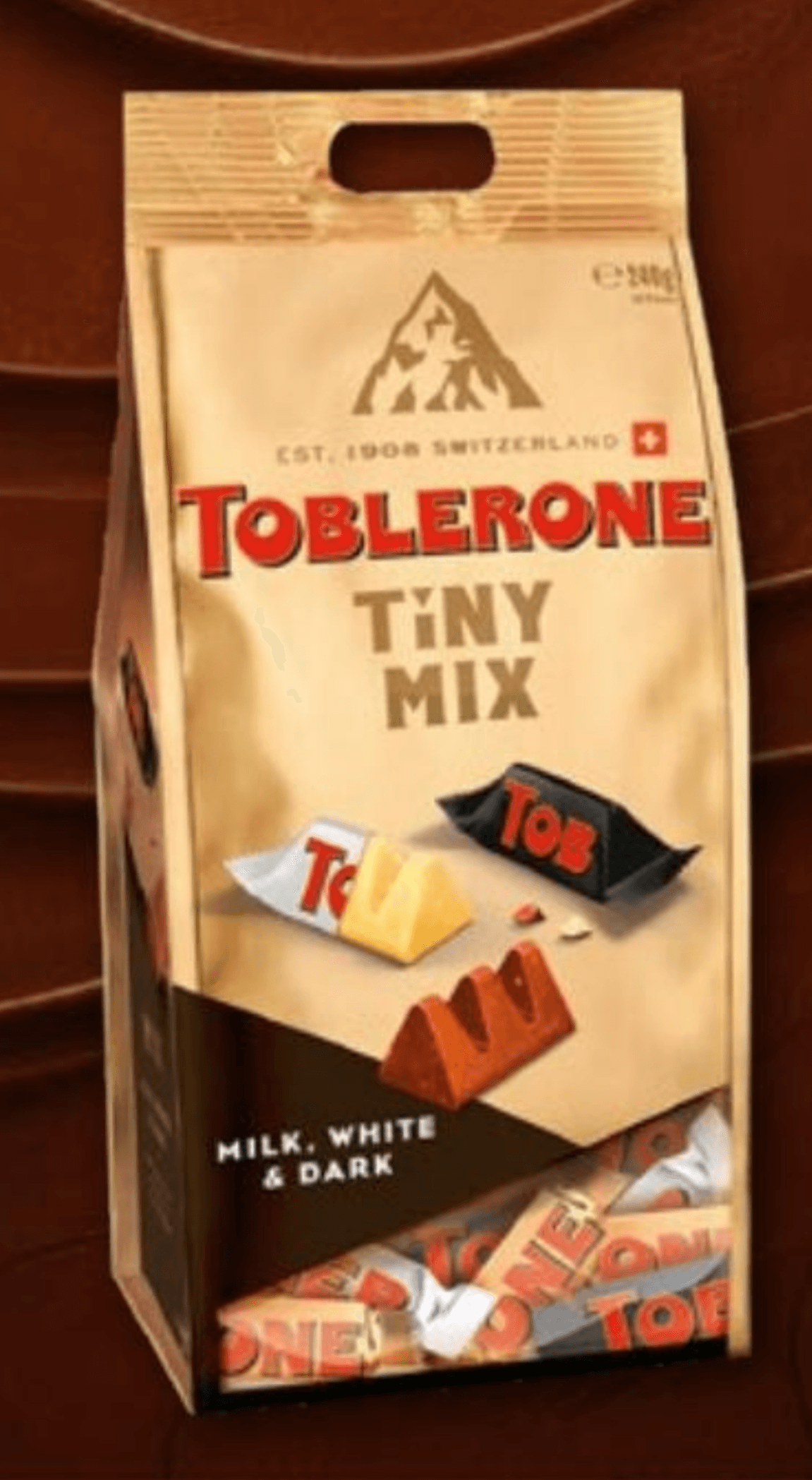 TOBLERONE Tiny mlečna, temna in bela čokolada z medom in mandljevim nugatom 240 g - Akcija v trgovini Kompas Shop
